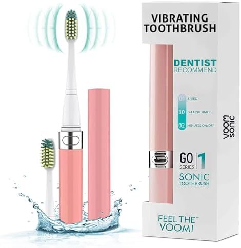 Pink battery powered sonic travel toothbrush