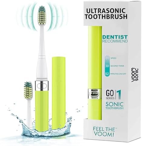 Yellow battery powered sonic travel toothbrush