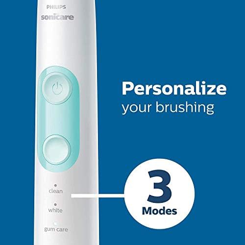 Black rechargeable toothbrush with three heads — photo 5