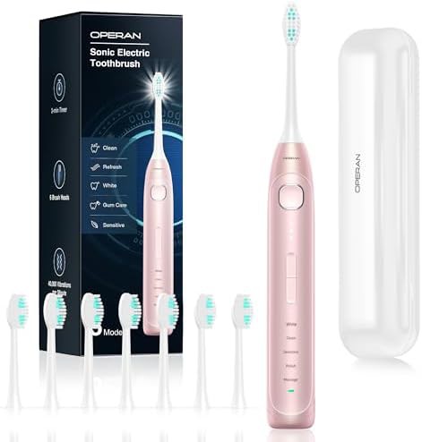 Pink sonic toothbrush with eight heads