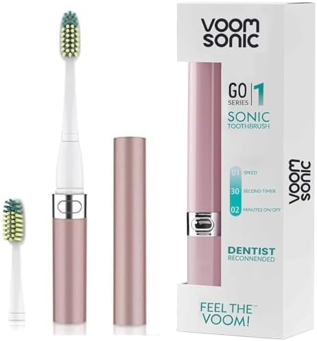 Travel sonic toothbrush with four brush heads — photo 3