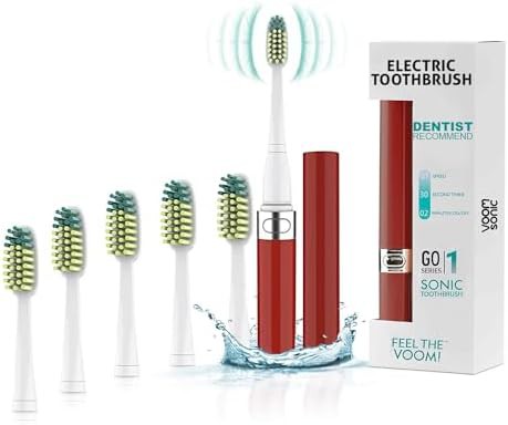 Metallic red travel sonic toothbrush with heads