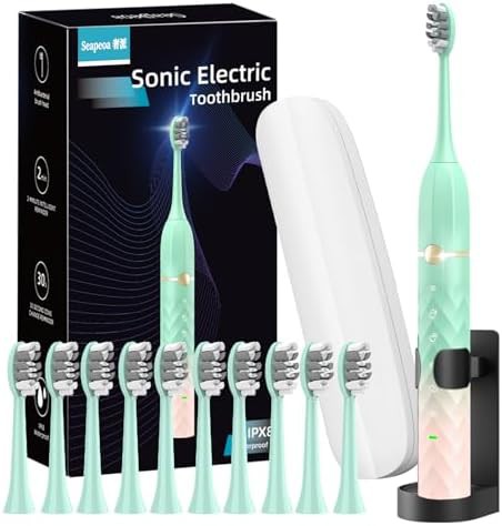 Green and pink sonic toothbrush set
